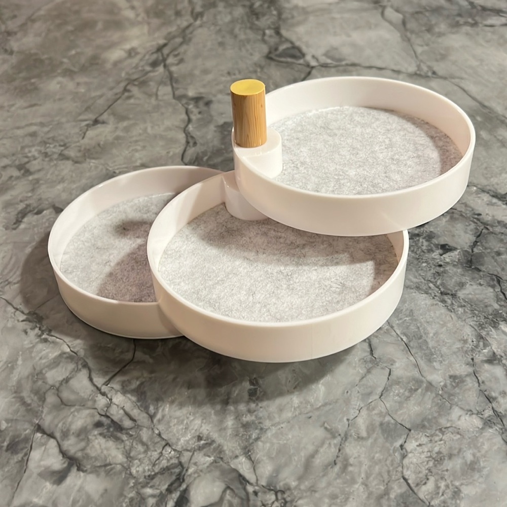 Three tiered catchall tray. Plastic with felt lining. In original box.